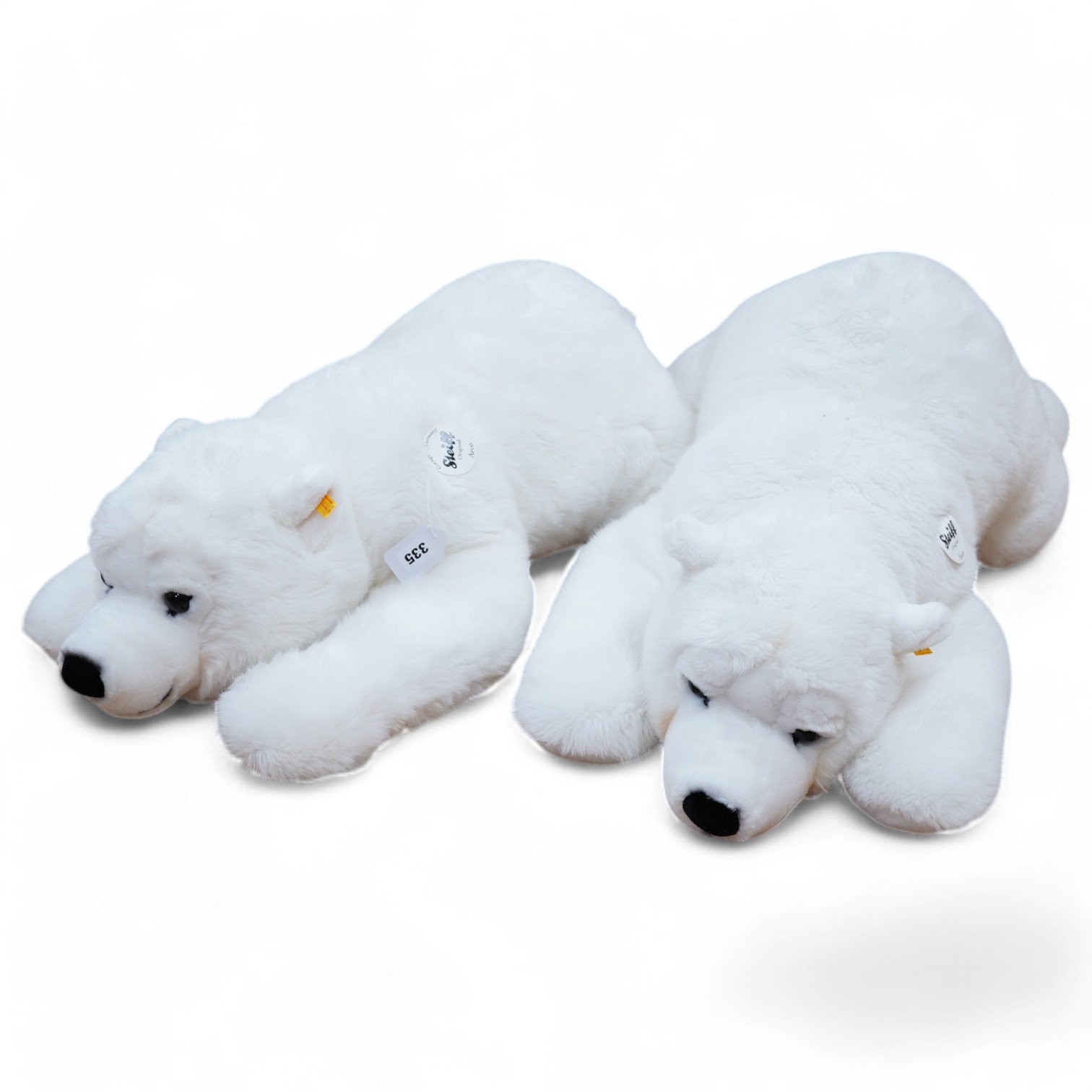 Two large modern Steiff polar bears, both with buttons in the ears and original card tags still attached. Condition - fair to good.